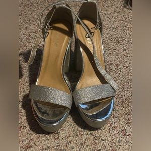 Bamboo glittery silver heals size 10 with strap around ankle with 3” heel